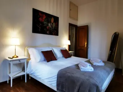 a bedroom with two beds with towels on them at Key apartments Vatican Flat in Rome