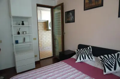 a bedroom with a bed with two pillows on it at Stazione Trastevere Apartment in Rome