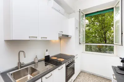 a kitchen with a sink and a window at Clodia 5 by Rental in Rome in Rome