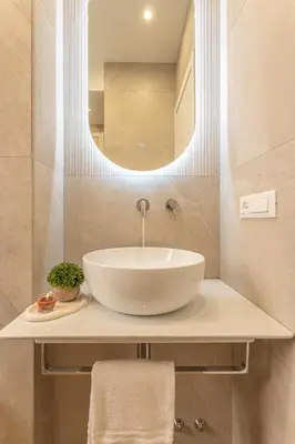 a bathroom with a white sink and a mirror at Vatican Modern Apartment 5 min Metro A - Terrestre in Rome