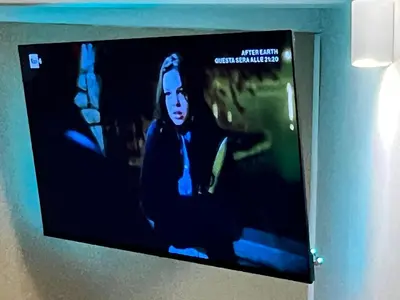 a flat screen tv hanging on a wall at Historical Houses in Rome