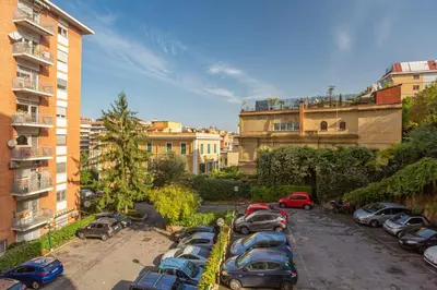 a bunch of cars parked in a parking lot at Roma is amoR in Rome
