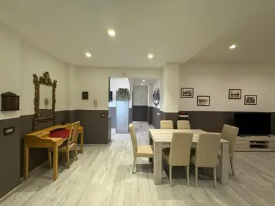 a dining room with a table and chairs at Laura's house in Alberone in Rome