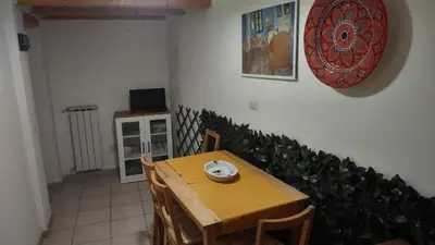 a table and chairs with a plate on top of it at Saint Peter Apartment in Rome