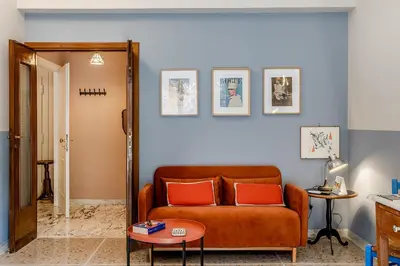 a living room with a couch and a table at Atelier Gianicolo Suite in Rome