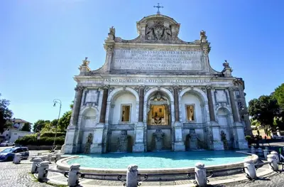 a building with a fountain in front of it at Atelier Gianicolo Suite in Rome
