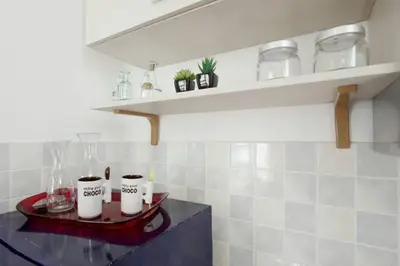 a kitchen with a sink and a stove at Testaccio Roma Style Apartment in Rome