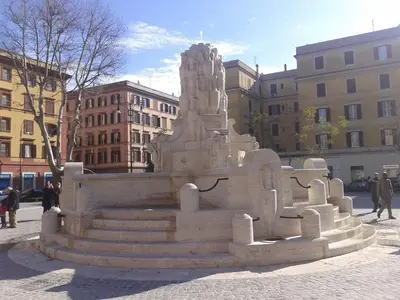a monument in the middle of a city with buildings at Testaccio Roma Style Apartment in Rome