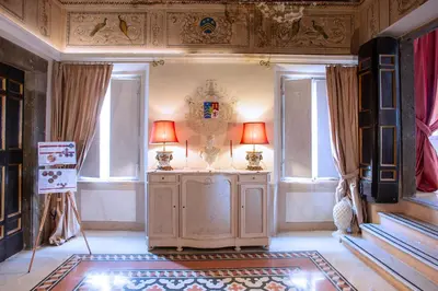 a room with two lamps on a cabinet and windows at Il sogno delle tartarughe in Rome