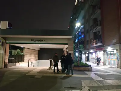 a city street at night with a building at DàLù alPigneto in Rome