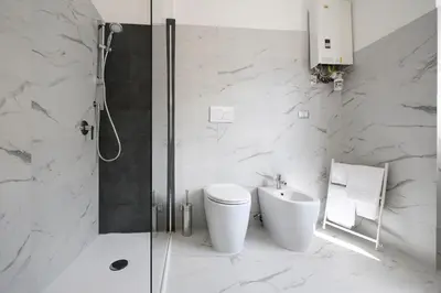 a bathroom with a shower and a toilet and a sink at La Casa Sui Musei Vaticani in Rome