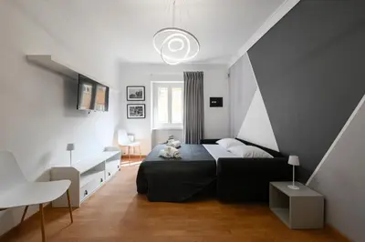 a bedroom with a bed with a teddy bear on it at La Casa Sui Musei Vaticani in Rome