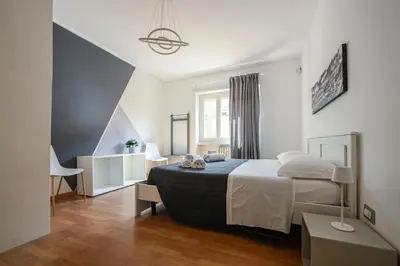 a bedroom with a large bed in a room at La Casa Sui Musei Vaticani in Rome