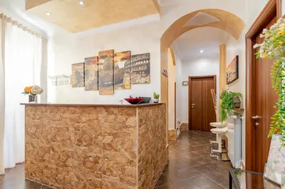 a bathroom with a shower and a toilet and a sink at Alis Laura - 10 mins to Colosseum, Modern & Near Metro in Rome