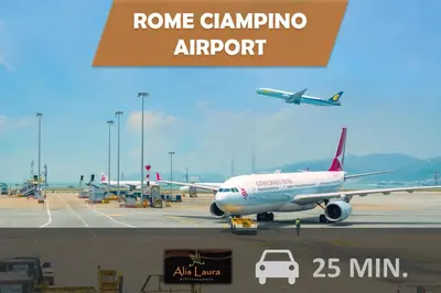 an airplane is parked on the runway at an airport at Alis Laura - 10 mins to Colosseum, Modern & Near Metro in Rome
