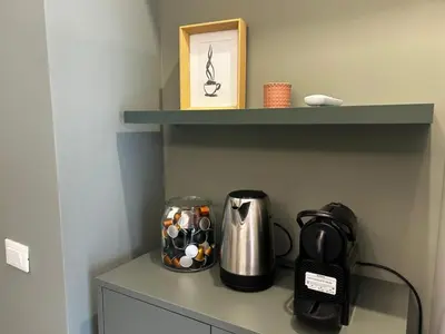 a coffee maker and a coffeemaker sitting on a shelf at Provincie 55 in Rome