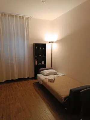 a bedroom with a bed and a lamp in it at Dolceborgo al Vaticano in Rome