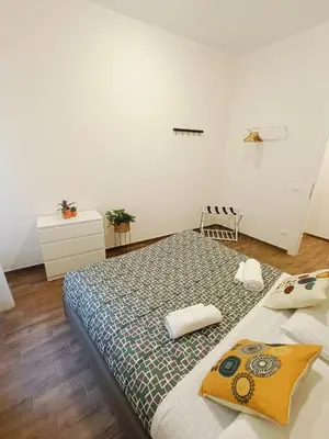 a bedroom with a large bed in a room at Dolceborgo al Vaticano in Rome