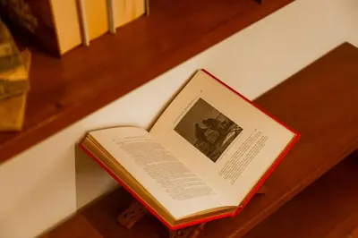 a book sitting on top of a stair case at Borgo Pio 64 - Vatican City in Rome