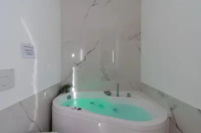 a bathroom with a bath tub with a sink at Elegante Appartamento presso Vaticano in Rome