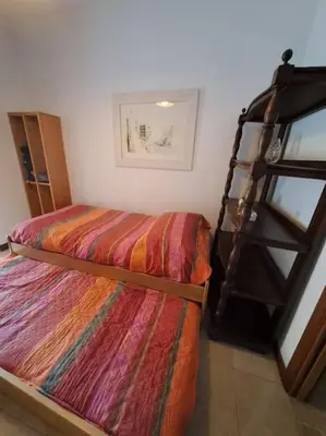 a bedroom with a bunk bed and a ladder at Casa Nisio - Gemelli comoda e accogliente in Rome