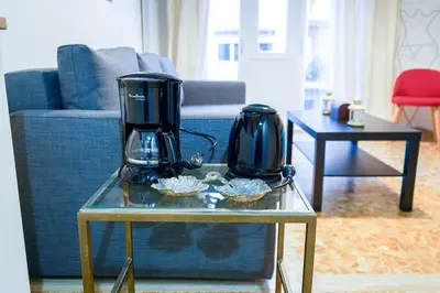a living room with a table with two appliances on it at The Twenty - Vatican Apartment in Rome