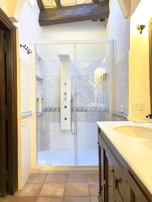 a bathroom with a shower and a sink at The Gem - Trastevere Cozy Retreat with pool in Rome