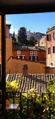 a view from a window of a courtyard with buildings at The Gem - Trastevere Cozy Retreat with pool in Rome