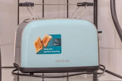 a toaster is shown with a piece of toast at Your Whole Suite in Rome