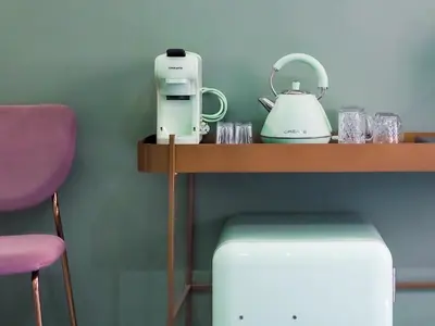a table with a coffee maker and a blender on it at C'est La Vie Suites in Rome