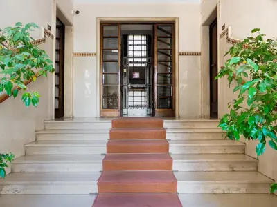 a staircase leading to a door in a building at C'est La Vie Suites in Rome