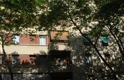 a building with trees in front of it at Ababaluba - Colosseo - San Giovanni in Rome