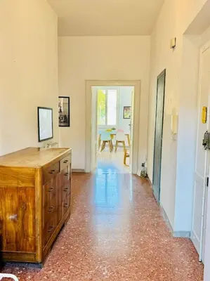 a bedroom with two beds and a window at Casa Rica at Vatican and St Peter in Rome