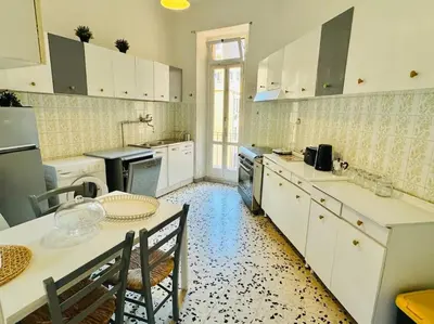 a kitchen with a table and a dining room at Casa Rica at Vatican and St Peter in Rome