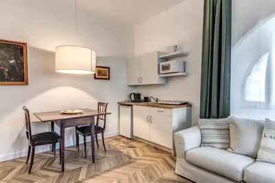 a small living room with a table and a couch at BelleArtiHome2 in Rome
