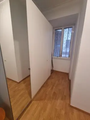an empty room with a mirror and a window at Casa intera vicino il centro per 4 persone in Rome