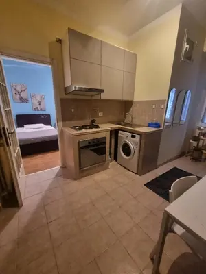 a kitchen with a stove and a washer and dryer at Casa intera vicino il centro per 4 persone in Rome