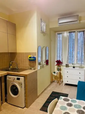 a kitchen with a washing machine in a room at Casa intera vicino il centro per 4 persone in Rome