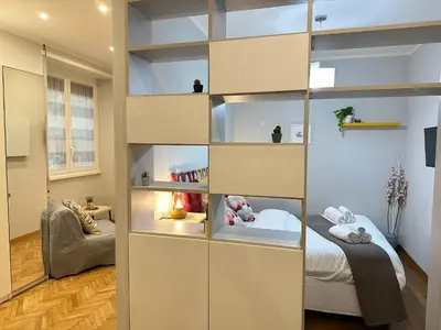 a room with a bed and a book shelf at Botticelli 2 Guesthouse in Rome