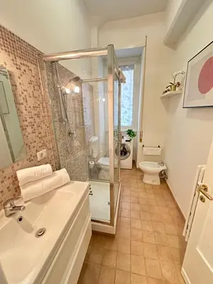 a bathroom with a shower and a sink and a toilet at Botticelli 2 Guesthouse in Rome