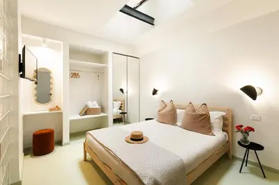 a bedroom with a bed with a hat on it at casa pinolo in Rome