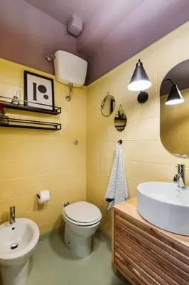 a bathroom with a sink and a toilet and a mirror at casa pinolo in Rome