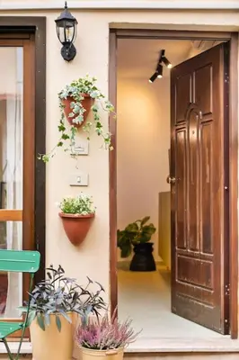 a door to a house with potted plants on it at casa pinolo in Rome