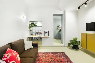 a living room with a couch and a tv at casa pinolo in Rome