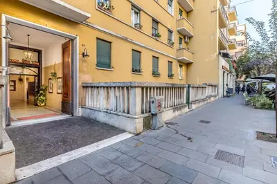 an empty street in front of a building at Sapienza Apt - Modern House in Piazza Bologna in Rome