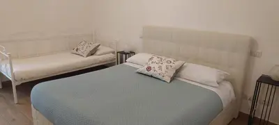 a bedroom with two beds with pillows on them at AugustoVera19 Tourist Accommodation in Rome