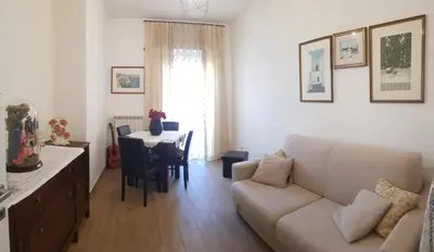 a living room with a couch and a table at AugustoVera19 Tourist Accommodation in Rome