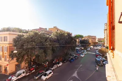 a city street with cars parked on the side of the road at Hostly-Maison Sant'Angelo-Few steps from Vatican in Rome
