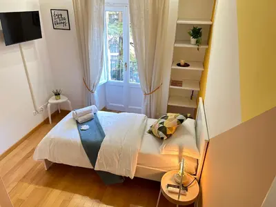 a small bedroom with a bed and a window at Angolo al Vignola in Rome