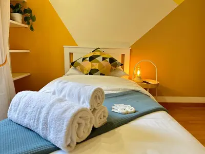 a bedroom with a bed with towels on it at Angolo al Vignola in Rome